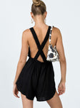 Black romper playsuit Linen look material  Elasticated halter neck tie fastening  Straight neckline  Frill trim  Low back 