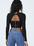 Long sleeve top Wide neckline  Panel stitching  Button fastening behind neck  Open back Exposed zip fastening at back 