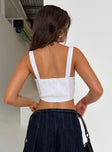 Corset top Broderie anglaise material Adjustable shoulder straps Square neckline Hook and eye fastening at front Shirred band at back Pointed hem