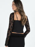 Long sleeve top Sweetheart neckline Adjustable shoulder straps Tie detail at bust Sheer lace sleeve