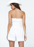 Strapless romper Lace details Ruffle neckline  Adjustable tie at neckline  Shirred back  Twin hip pockets 