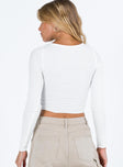 White long sleeve top V neckline Pinched detail at bust Good stretch Mesh lined front