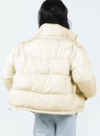 Two in one puffer jacket and vest High neck  Zip front fastening  Twin hip pockets  Drawstring waist 