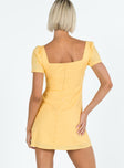 Yellow mini dress Square neckline Inner silicone stripe at bust and shoulders Invisible zip fastening at back 