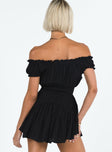 Black mini dress Shirred waistband Ruffle detailing Elasticated neck and sleeves Can be worn on or off shoulder Built in shorts Layered ruffle hem Fully lined