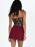 Mini skirt Mid low rise  V front waistline  Invisible zip fastening at side