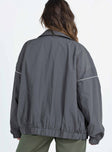 Grey jacket Pointed collar Zip fastening at front Drop shoulder Elasticated waistband and cuffs 