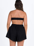 Black strapless romper Inner silicone strip at bust  Elasticated back and waist  Exposed back 