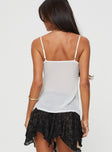 Lace top Adjustable shoulder straps, v-neckline, twin tie fastening at bust, split hem Non-stretch material, unlined, sheer