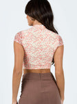 Crop top Lace material Floral print Cut out at front Single button fastening at neck