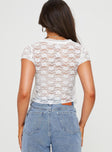 Lace crop top Plunging neckline, tie fastening at bust, pointed hem