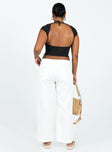 White pants Belt looped waist Zip and button closure Four pocket design Wide leg