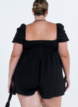 Black romper Muslin look material Square neckline  Elasticated puff sleeves Shirred back panel Invisible zip fastening at back  Relaxed leg 