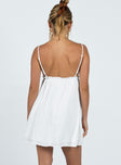 Mini dress Muslin look material Adjustable shoulder straps   Plunging neckline Ruffle detail  Elasticated back