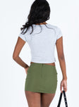 Green mini skirt Low rise Button detail at front Invisible zip fastening at back