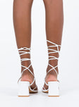 White heels Faux leather material  Strappy upper  Shaved block heel  Square toe  Ankle wrap fastening