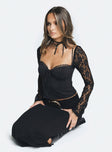 Long sleeve top Sweetheart neckline Adjustable shoulder straps Tie detail at bust Sheer lace sleeve