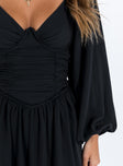 Black romper Balloon style sleeve  Wired cups Ruching throughout Boning at side Elasticated bands at back