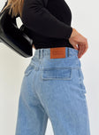 Wide leg jeans Mid wash denim Front button and zip fastening Belt looped waist Twin hip pockets Faux back pockets Ripped leg Frayed hem