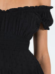 Black mini dress Shirred waistband Ruffle detailing Elasticated neck and sleeves Can be worn on or off shoulder Built in shorts Layered ruffle hem Fully lined