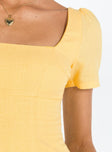 Yellow mini dress Square neckline Inner silicone stripe at bust and shoulders Invisible zip fastening at back 