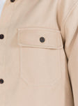 Beige jacket Soft material Pointed collar Button fastening at front Twin chest pockets Single button cuff