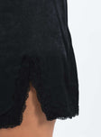 Black slim fitting mini skirt Invisible zip fastening at side Leg slit Lace trim Non-stretch Unlined