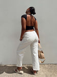 White pants Belt looped waist Zip and button closure Four pocket design Wide leg