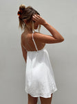 Mini dress Muslin look material Adjustable shoulder straps   Plunging neckline Ruffle detail  Elasticated back