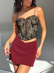 Mini skirt Mid low rise  V front waistline  Invisible zip fastening at side