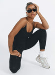 Black jumpsuit Ribbed material Scooped neckline Adjustable shoulder straps Good stretch Unlined 