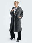 Coat Collared neckline Front button fastening Twin side pockets