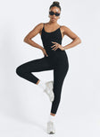 Black jumpsuit Ribbed material Scooped neckline Adjustable shoulder straps Good stretch Unlined 