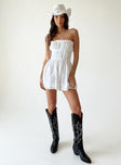 Strapless romper Lace details Ruffle neckline  Adjustable tie at neckline  Shirred back  Twin hip pockets 